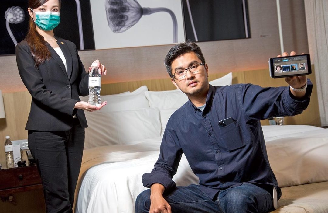 Empower Hotel Guest Experience with Voice AI Technology CEO and hotel staff showing Aiello Assistant in hotel room