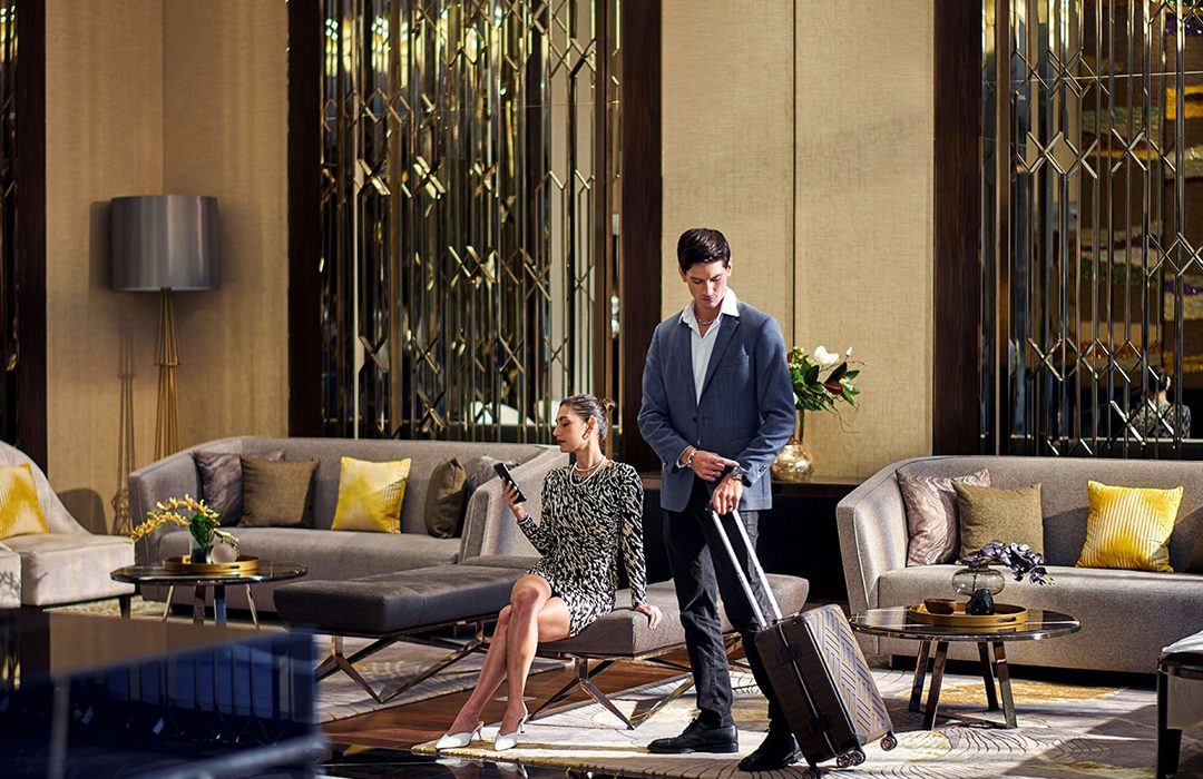 chartium-lobby-luxury-hotel-ai Guests relaxing in the lobby at Chatrium Grand Bangkok.